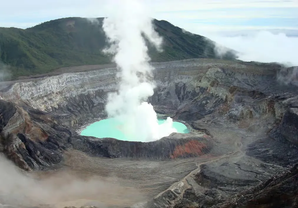 Steaming turquoise crater lake of Poás Volcano